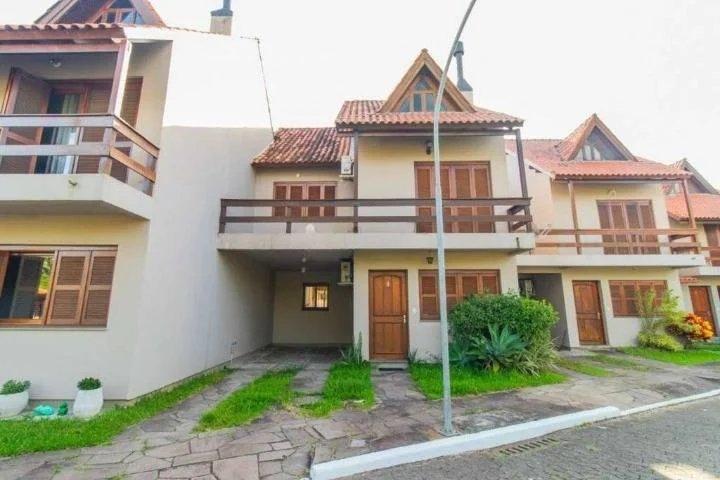 Casa de condomínio com 3 quartos, 197m², à venda em Porto Alegre, Guarujá